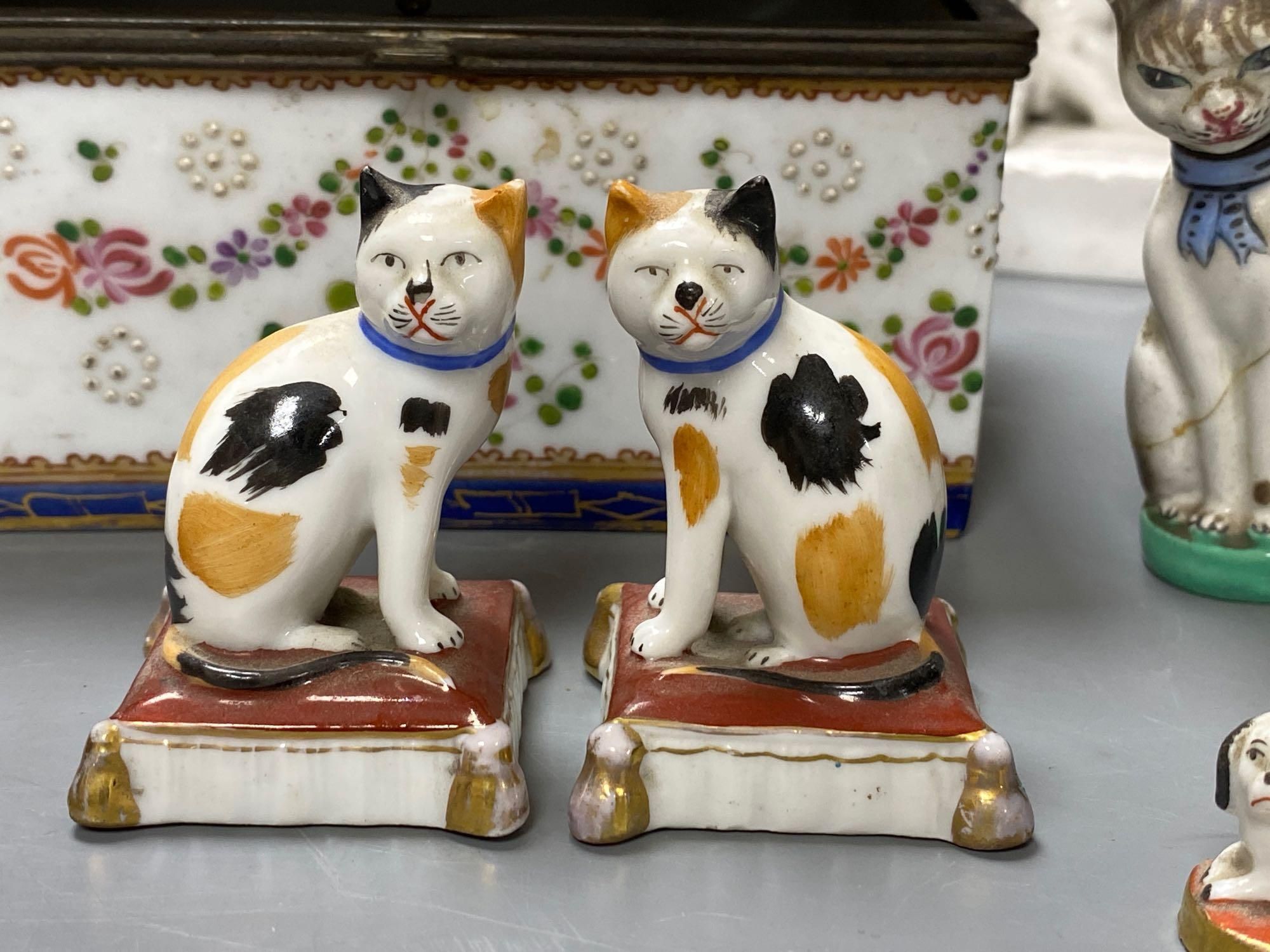 Two Crown Derby white glazed figures, 30 and 32.5cm, a group of Continental ceramics and a carved nut group